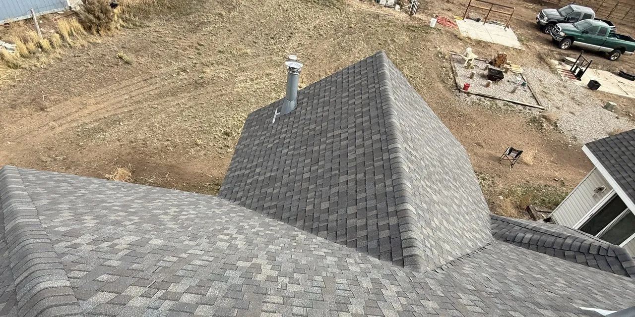 Utah residential home with completed roof replacement - premium architectural shingles installed by Frame Restoration Utah