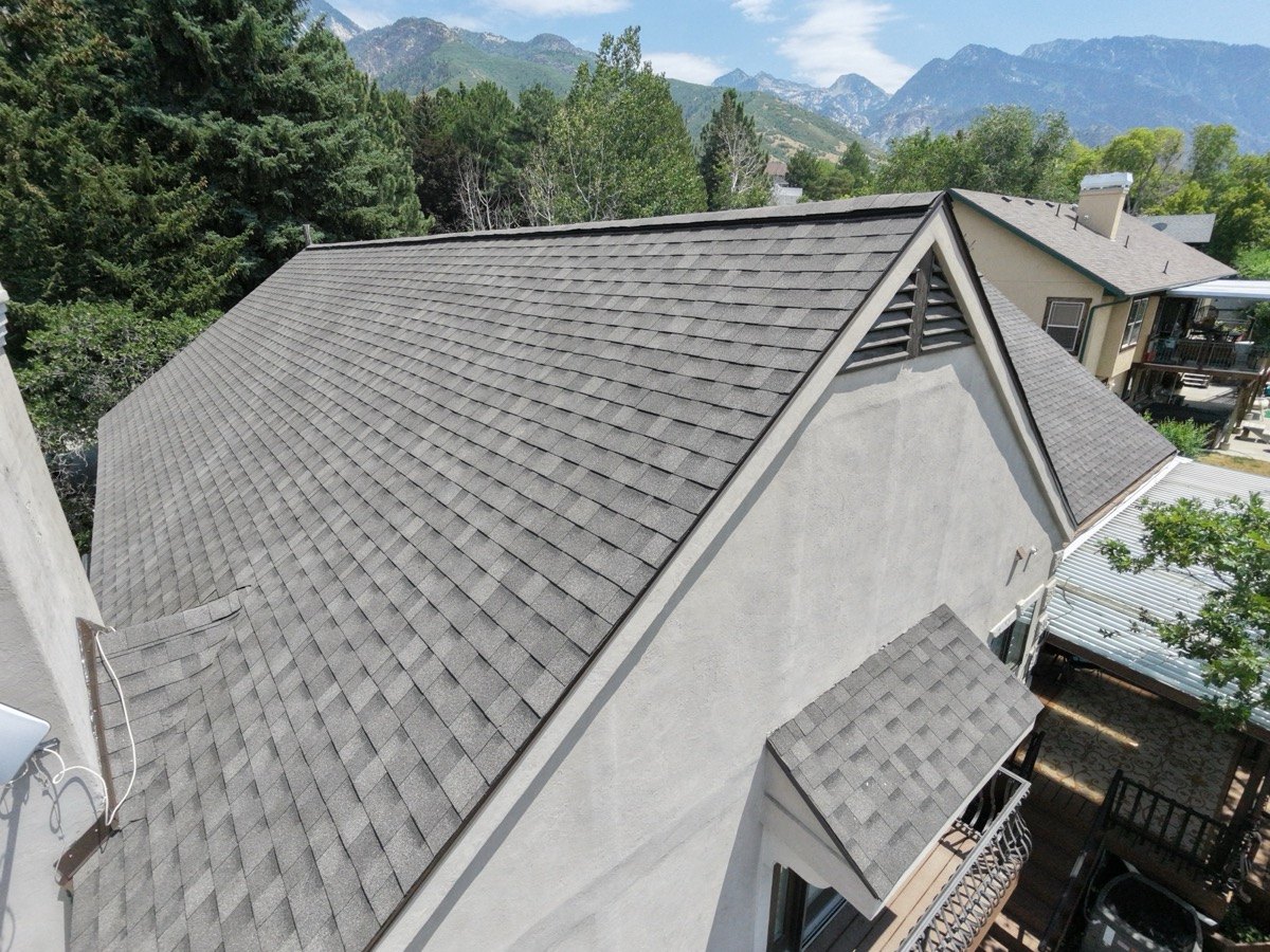 Completed Frame Restoration Utah architectural shingle roof with Wasatch mountain backdrop, July 2026 drone photo