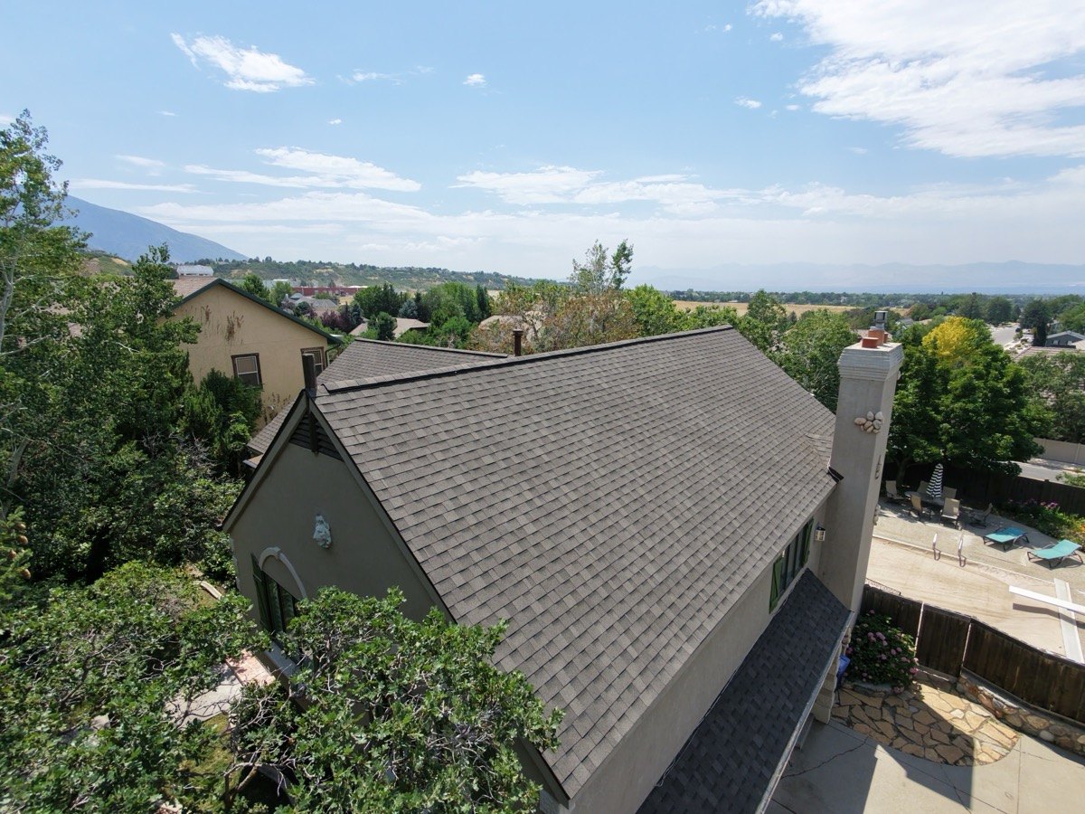 Finished residential roof by Frame Restoration Utah with broad Utah valley view, July 2026 drone photo