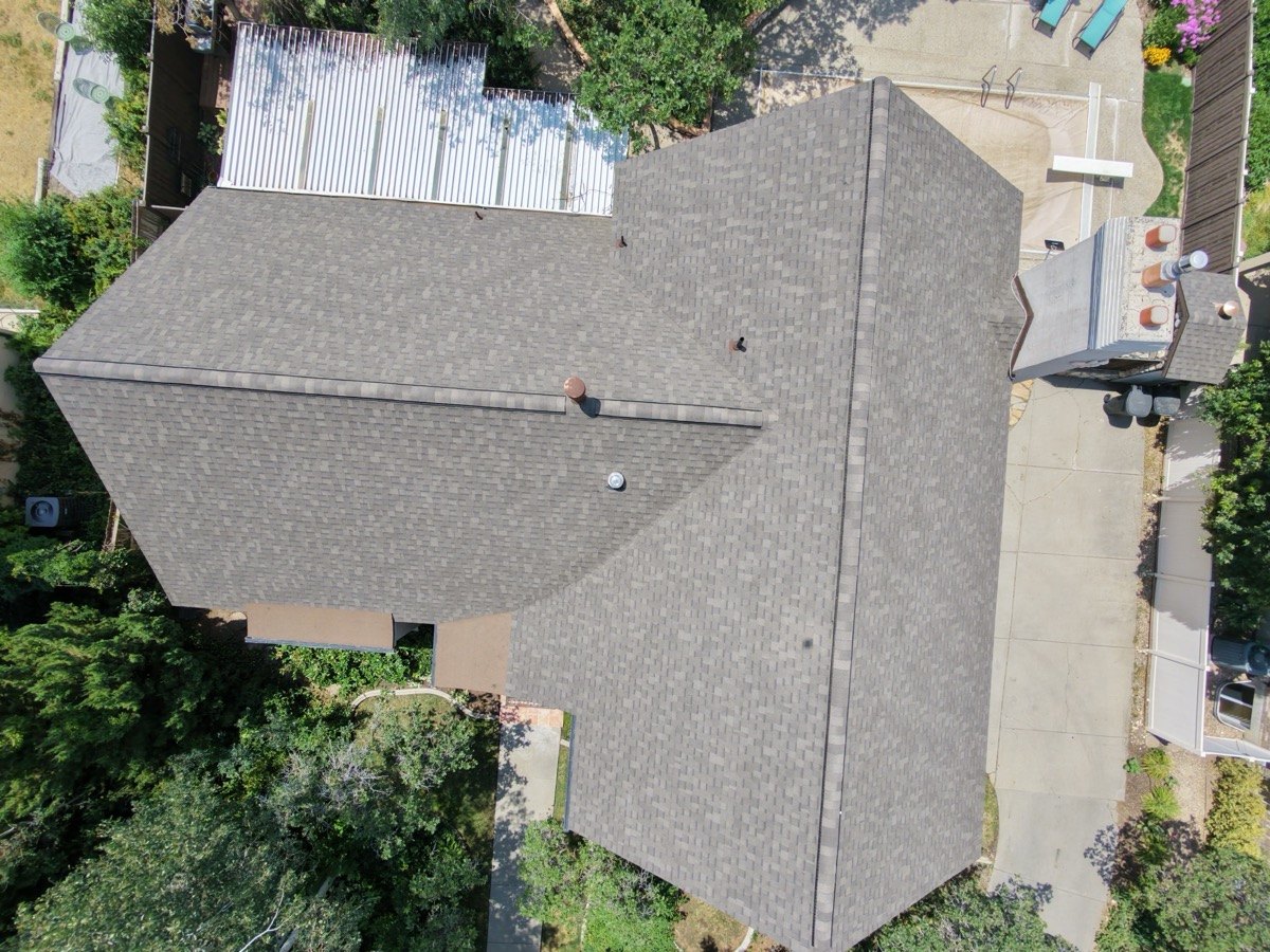 Top-down July 2026 drone photo showing completed shingle roof detail by Frame Restoration Utah