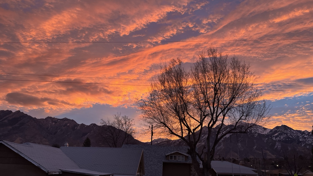 Cottonwood Heights Utah neighborhood rooftops below Mt. Olympus and the canyon mouths where Frame Restoration Utah responds to wind and hail storm damage