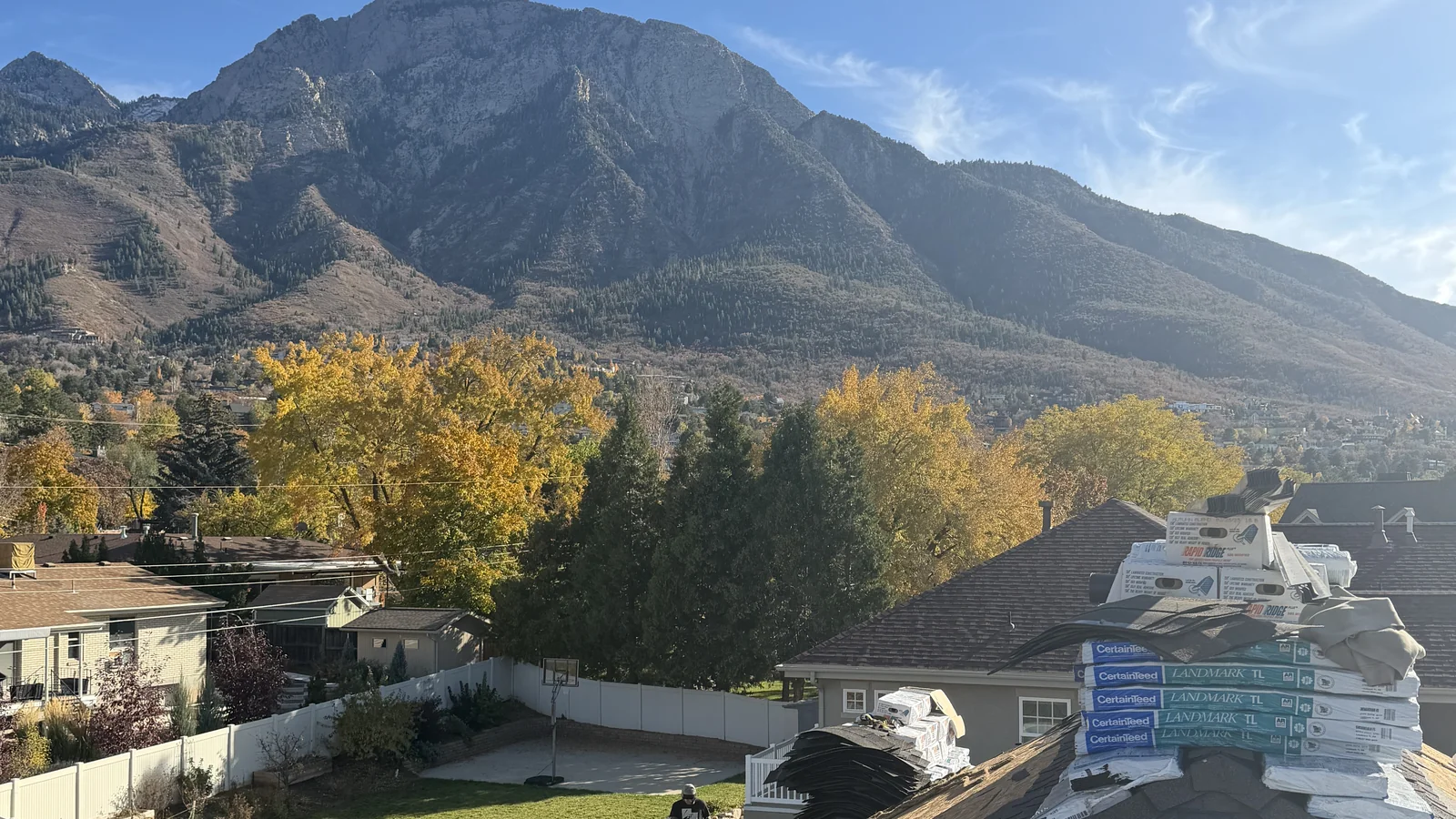 Architectural shingle roof install in Holladay, Utah with Mt. Olympus backdrop