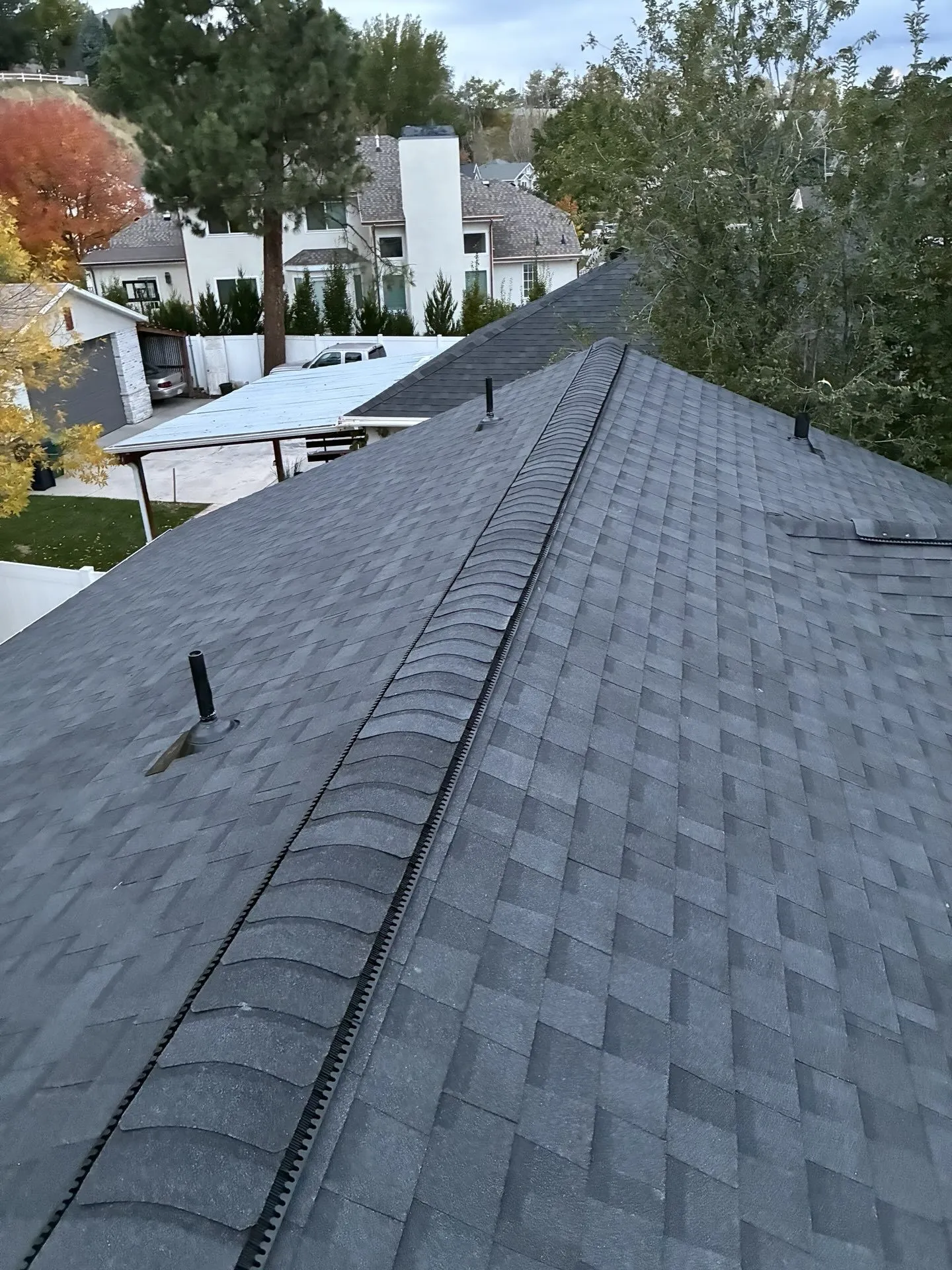 Storm damage roof restoration with clean ridgeline in Sandy, Utah — Frame Restoration Utah